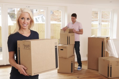 Removals team loading boxes during ethical operations
