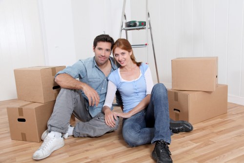 A professional removals team navigating a busy London street in Shepherd’s Bush