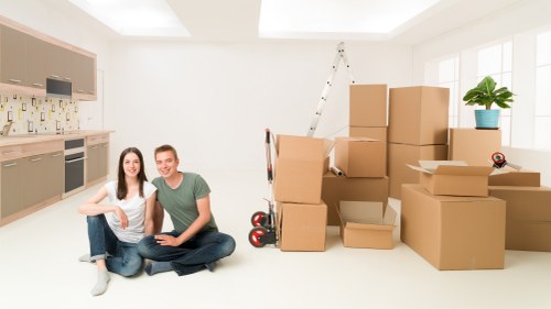 Packing and boxing household items for a move in West London